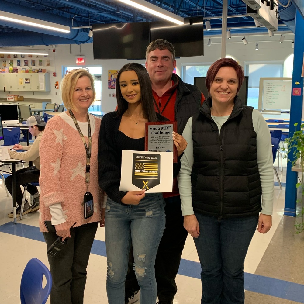 ​​Pictured Left to Right: R.W. Creteau Technology Center Director Michele Halligan-Foley, student Hope Silveira, Spaulding Principal Justin Roy, and Graphic Design Instructor Lori Discoe.