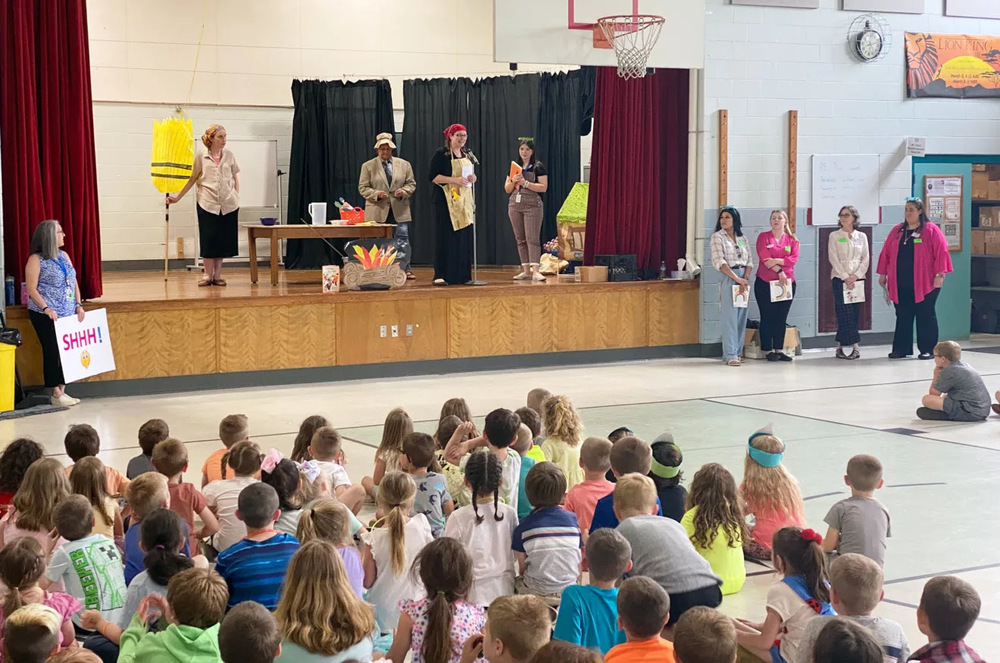 Reading teachers at the East Rochester School present a skit to students to help kickoff a summer reading program. (Courtesy Rochester School District)