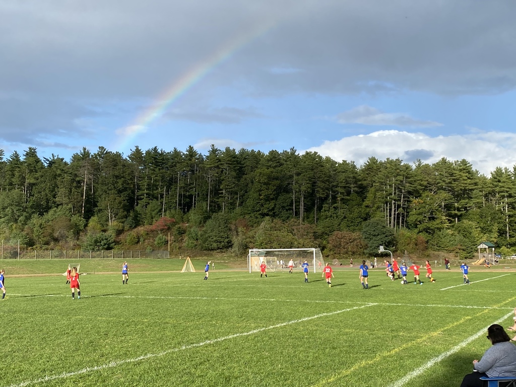 RMS girls soccer game with rainbow in the background