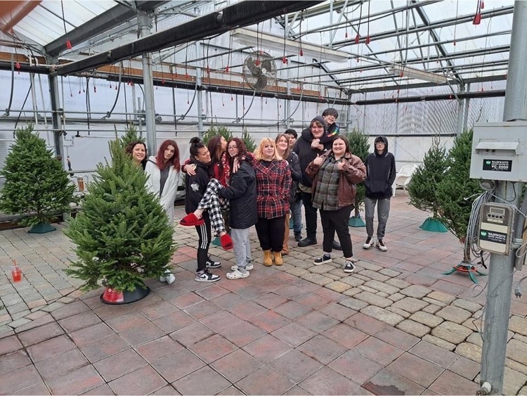 Students with Christmas Trees